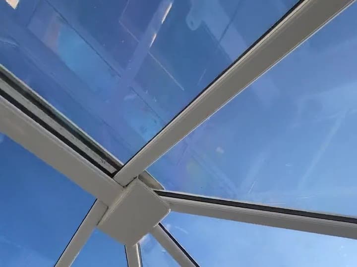 Looking up through a conservatory roof: the glass stays bright with the film fitted